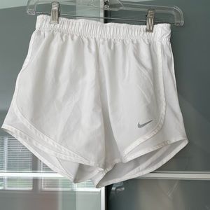 White Nike running shorts
